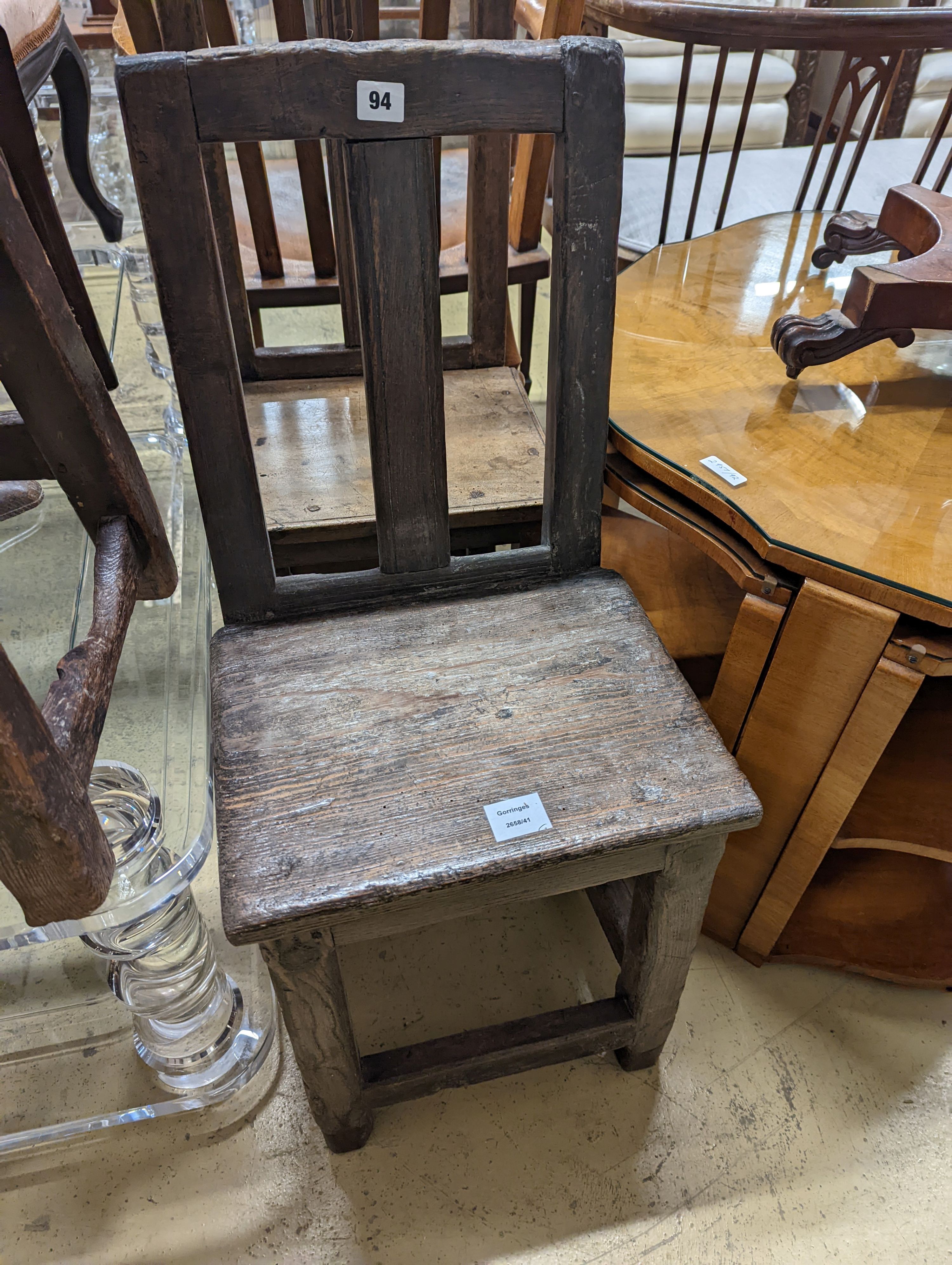 Two antique walnut or pine backstools.